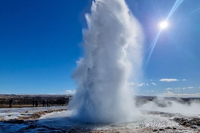 The Strokkur geyser throwing a column of water above the Geysir geothermal field